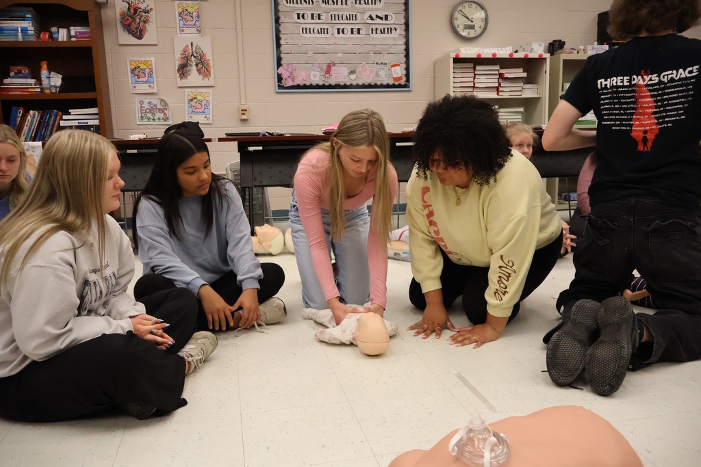 Students learning CPR