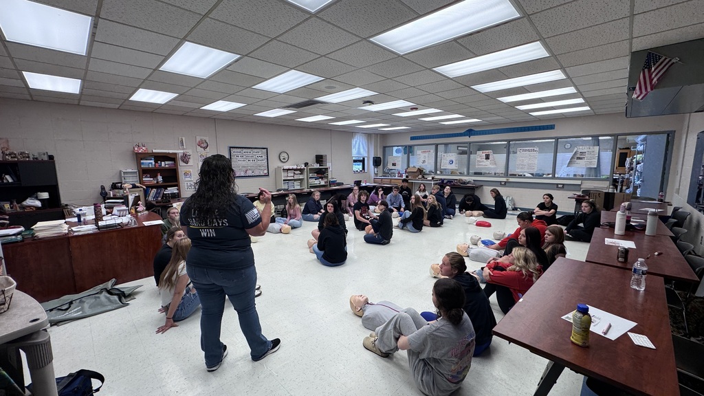 Students learning CPR
