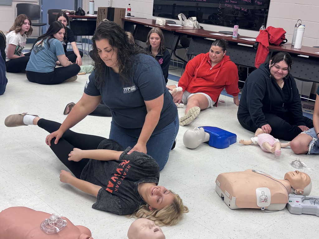 Students learning CPR