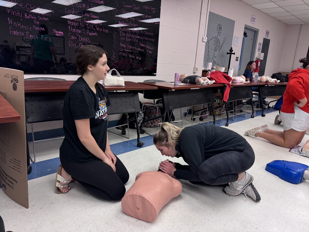 Students learning CPR