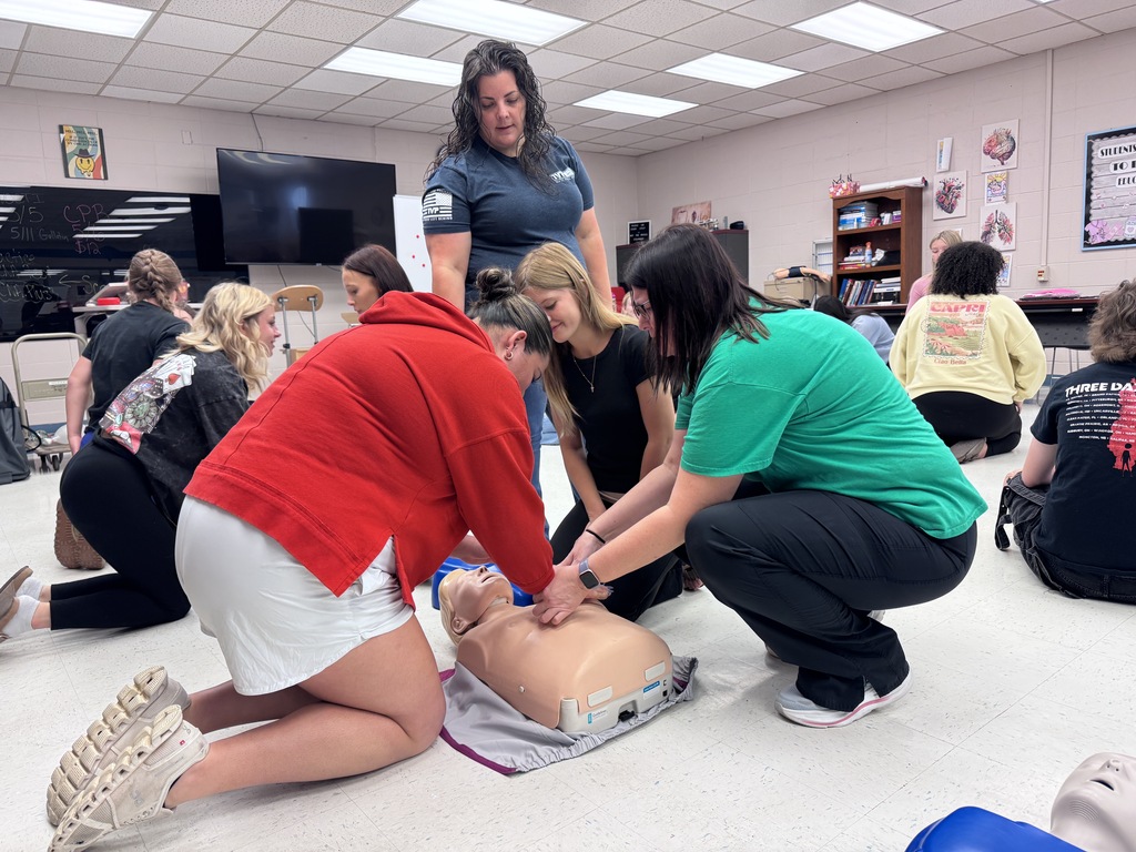 Students learning CPR