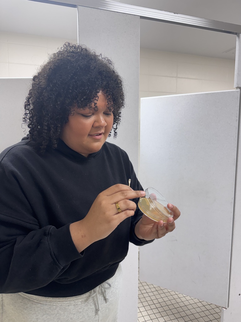 Nursing student swabbing for germs