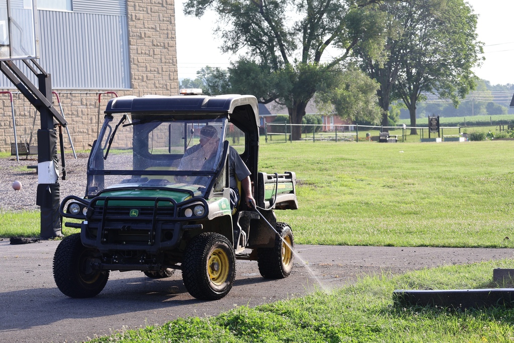 spraying weeds on playground