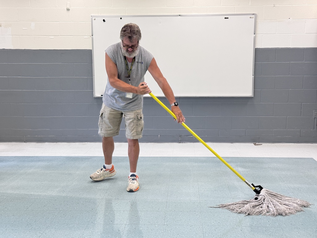 Custodian mopping floor
