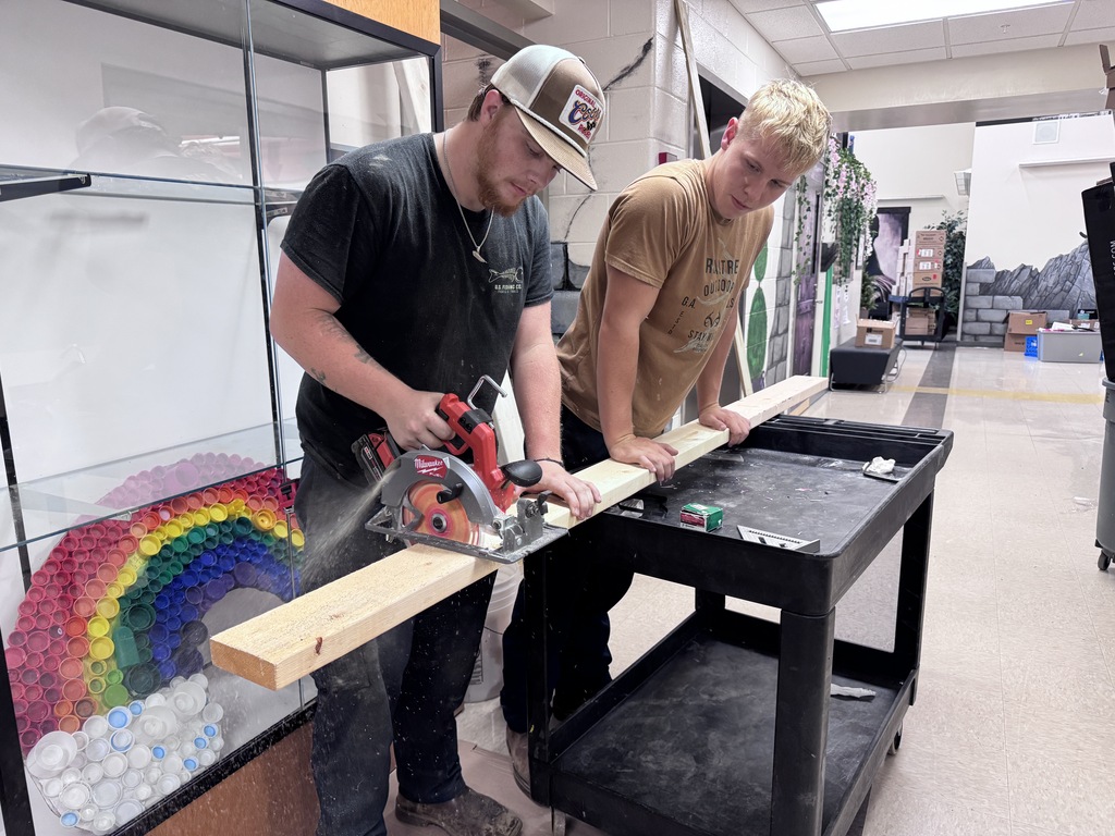 Maintenance staff cutting boards