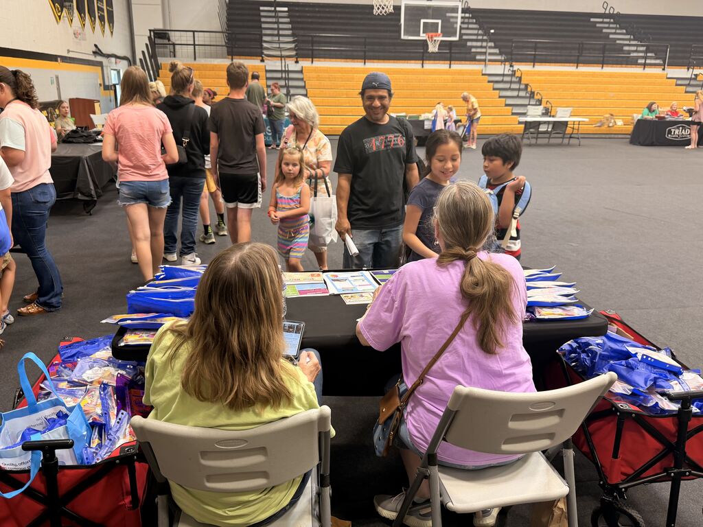Families walking through booths at Ready Fair