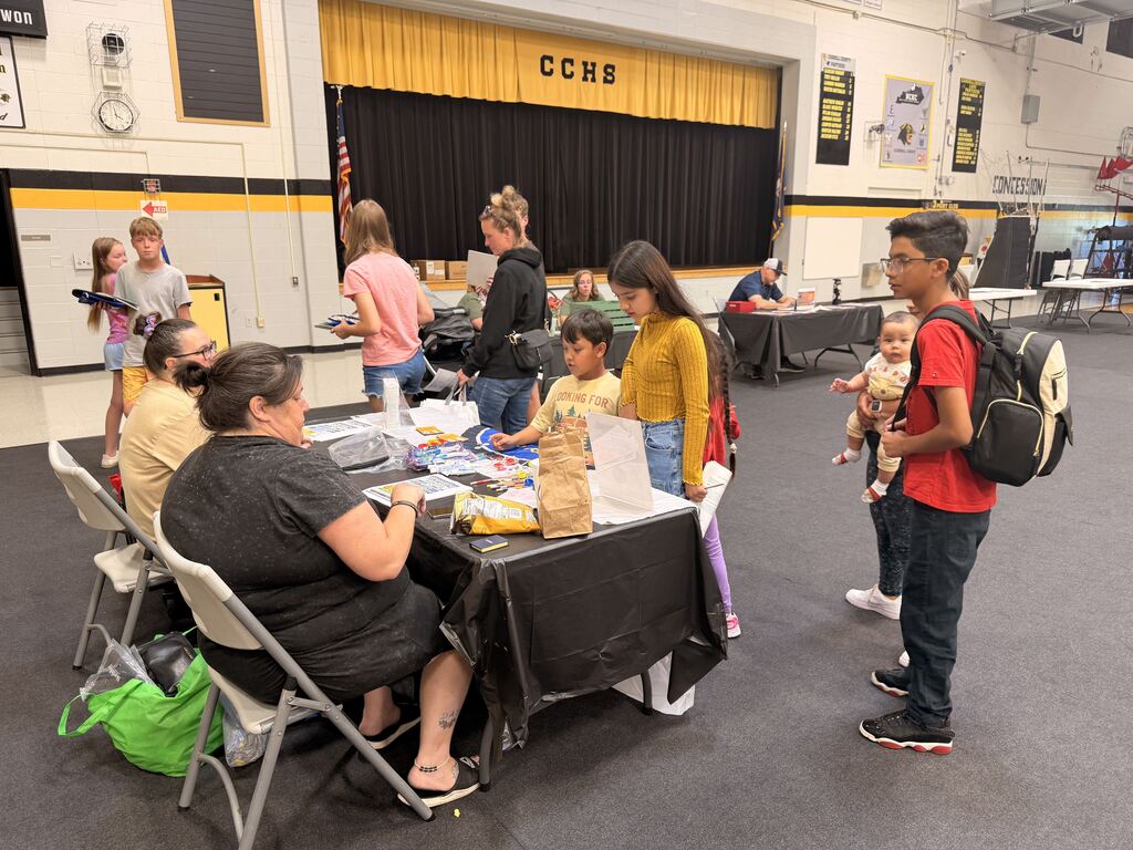 Families walking through booths at Ready Fair