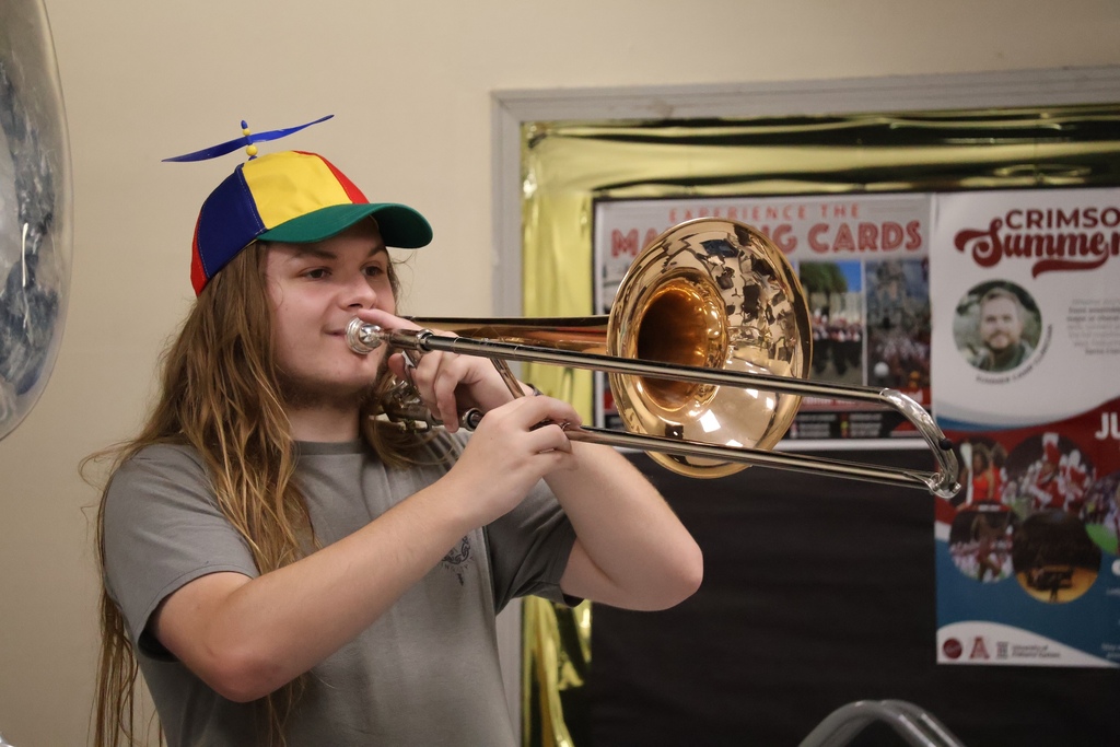 student playing instrument during band camp