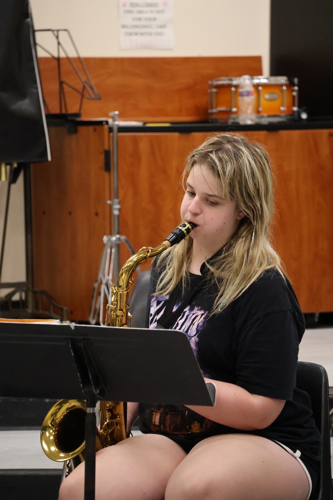 student playing instrument during band camp