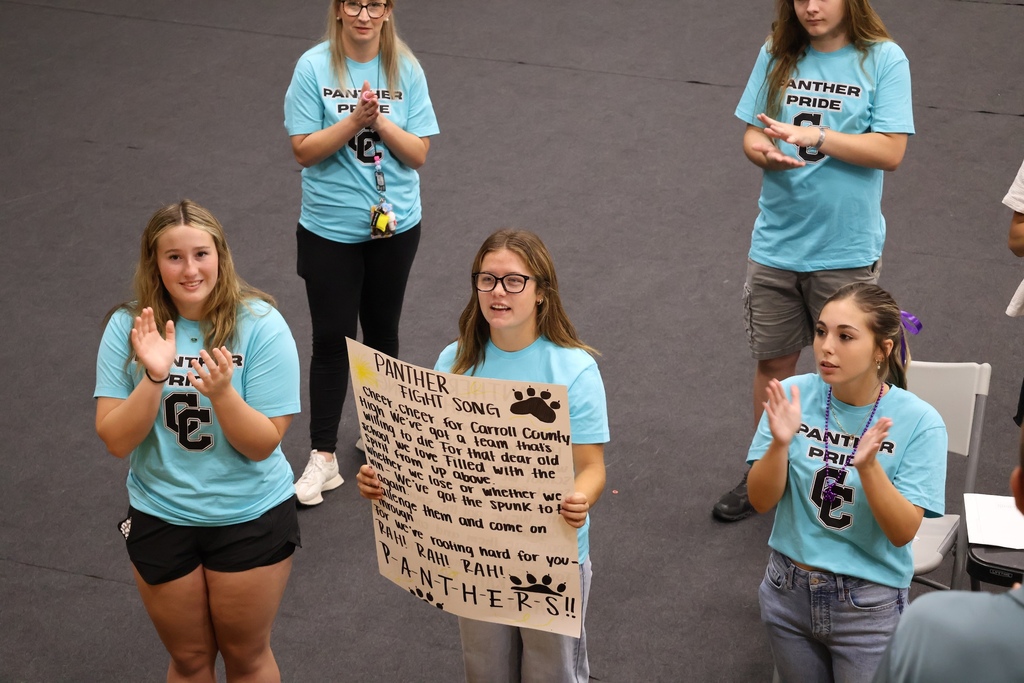 Students leading high school fight song