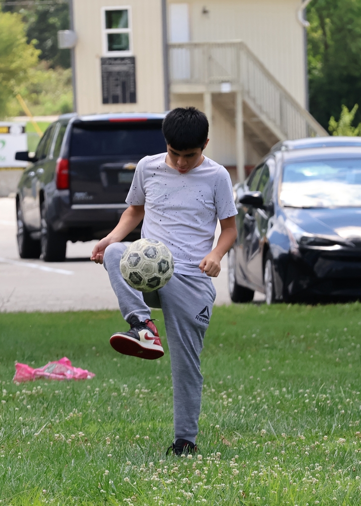 student playing soccer