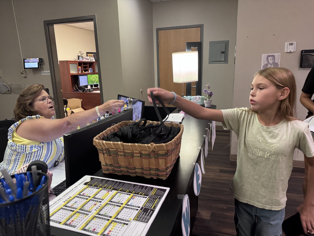 Fifth grade student receiving new badge