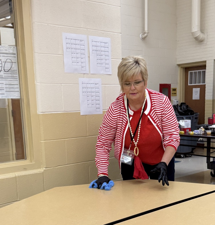 Dr. Stephenson wiping tables in cafe