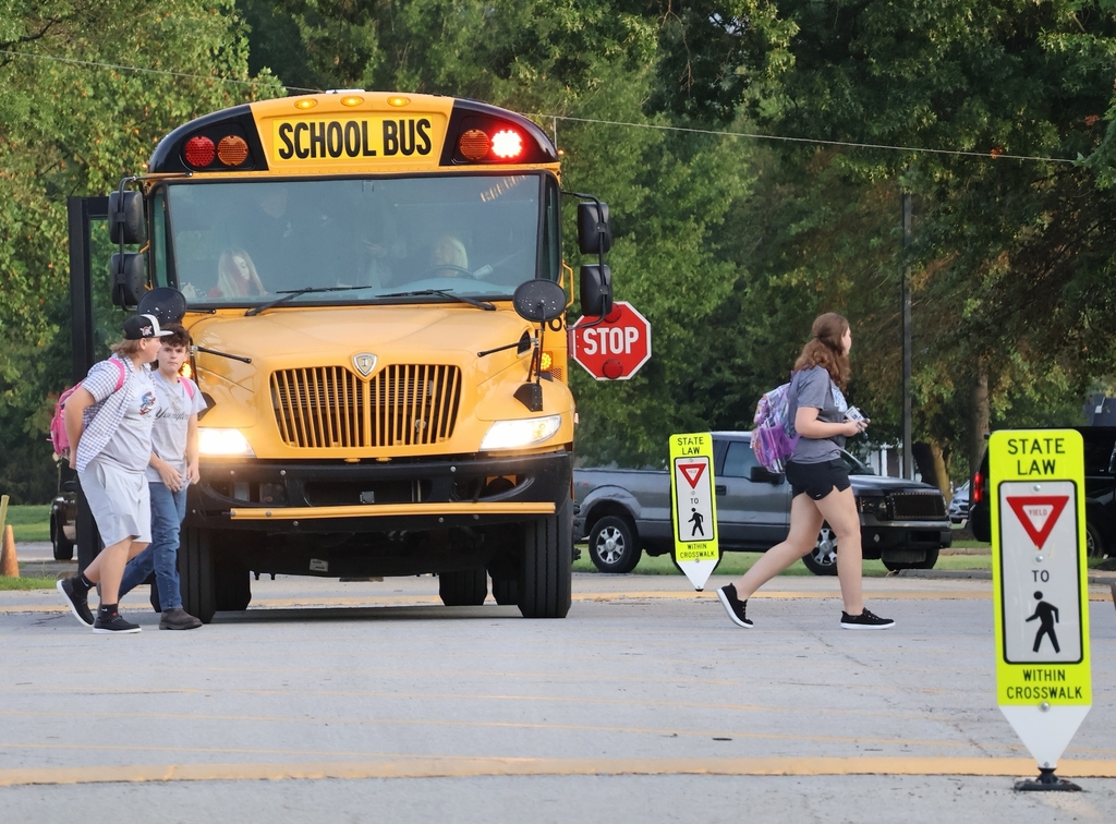 Students getting off school bus