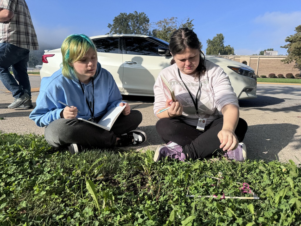 Students studying grass