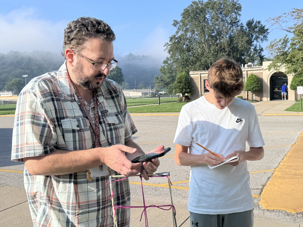 Students studying grass