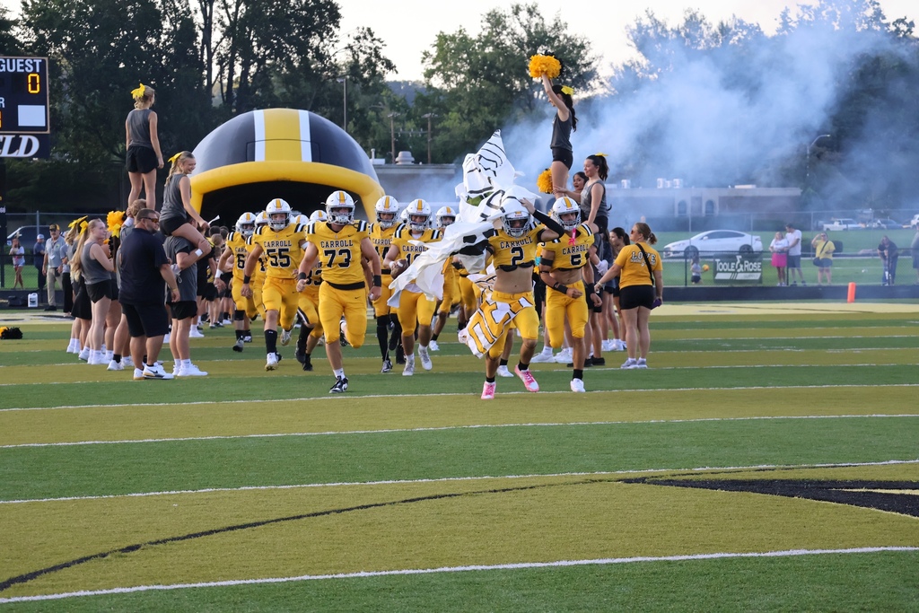 Football team running onto field