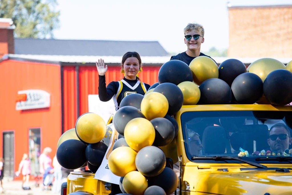 students riding in parade