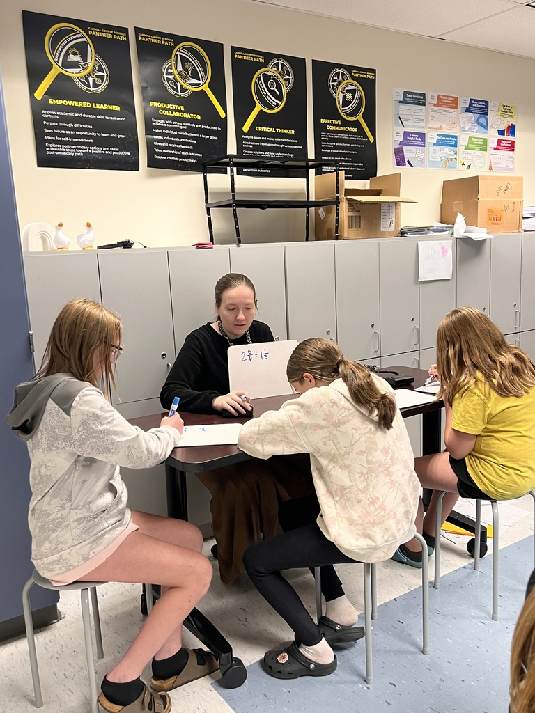 teacher and students working on math