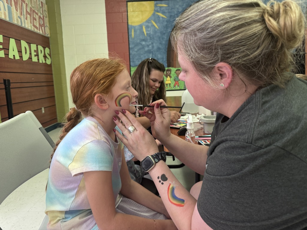 student getting face painted