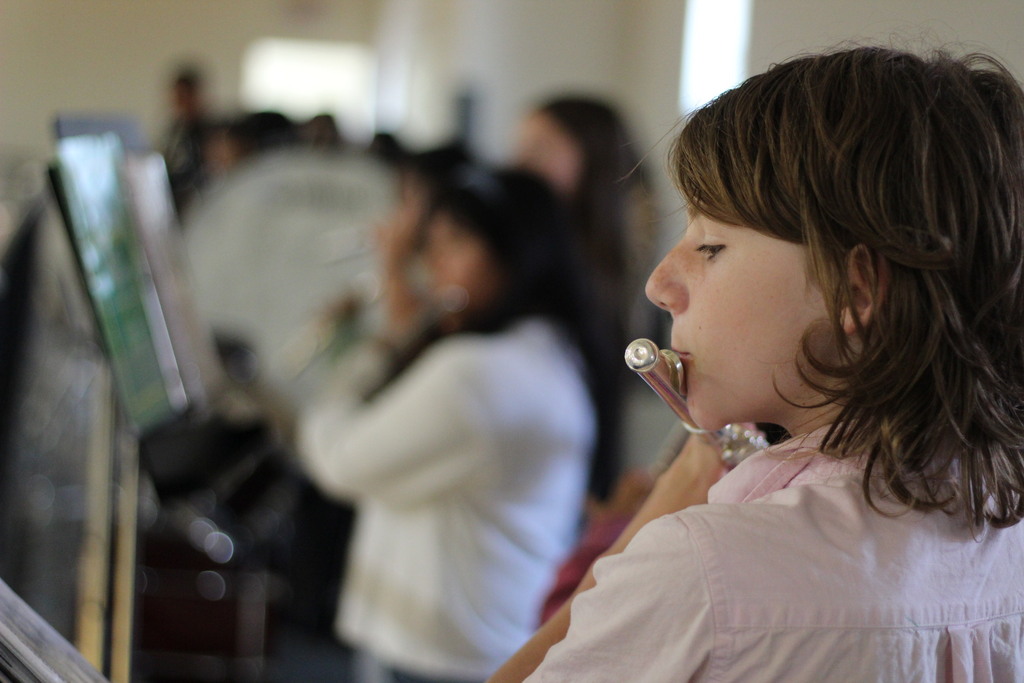 Photo of a student playing the flute at the House Assembly.
