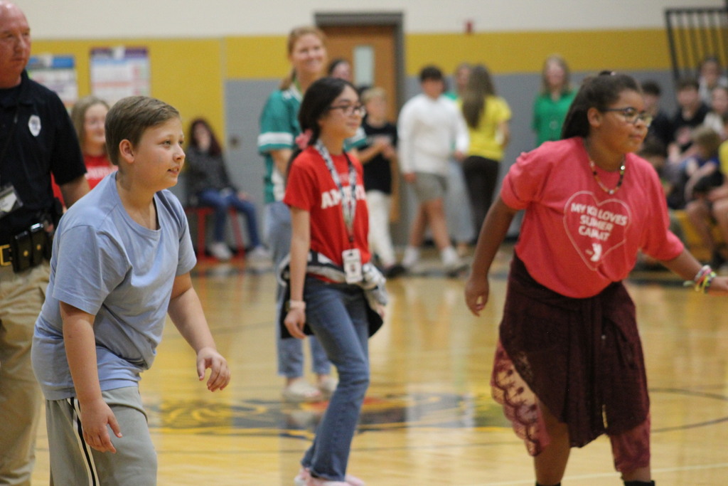 Students playing a game of Red Light, Green Light.