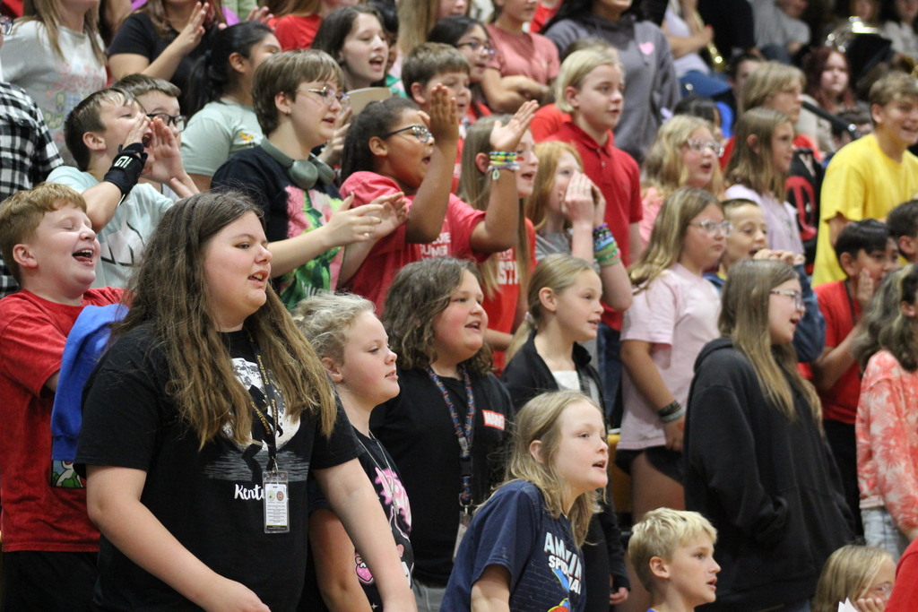 Photo of the students in Red House doing their house chant.