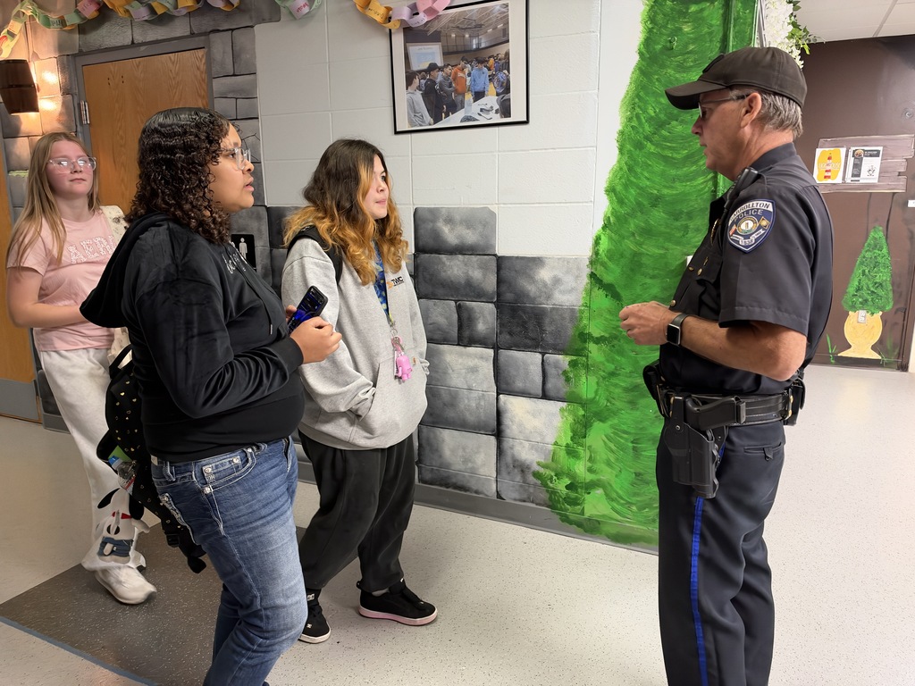 Officer talking to students