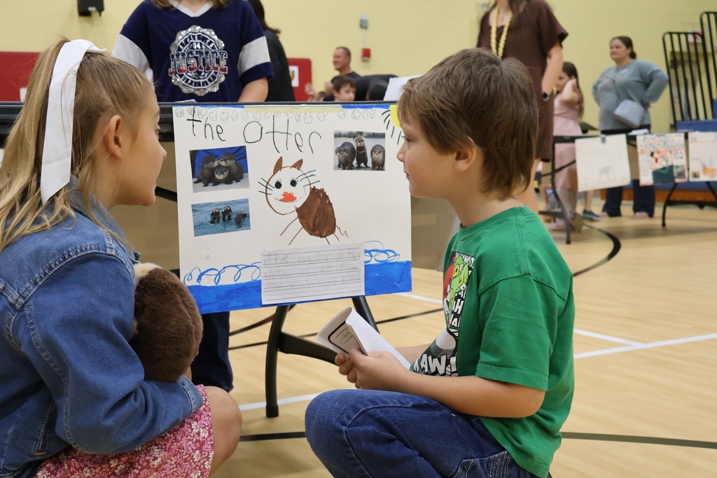 students talking about poster