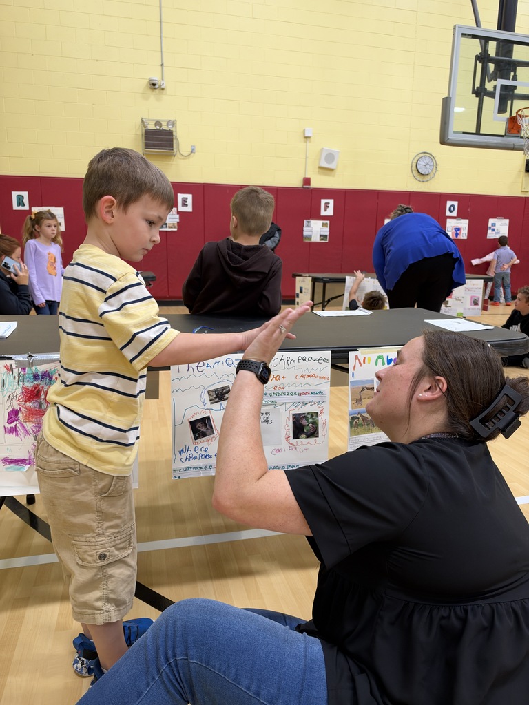 Teacher giving student a high five