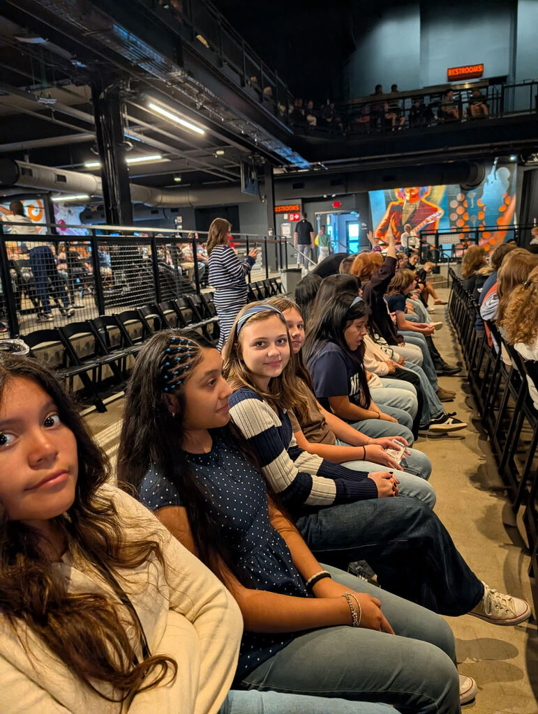 Photo from Orchestra Trip of students sitting in rows
