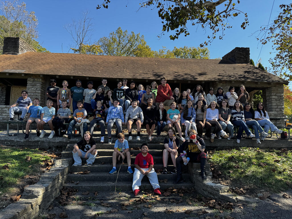 Photo from Orchestra Trip of a group of students outside at the park