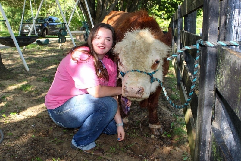 student with cow