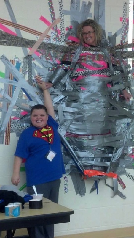 Jonica Ray taped to a wall