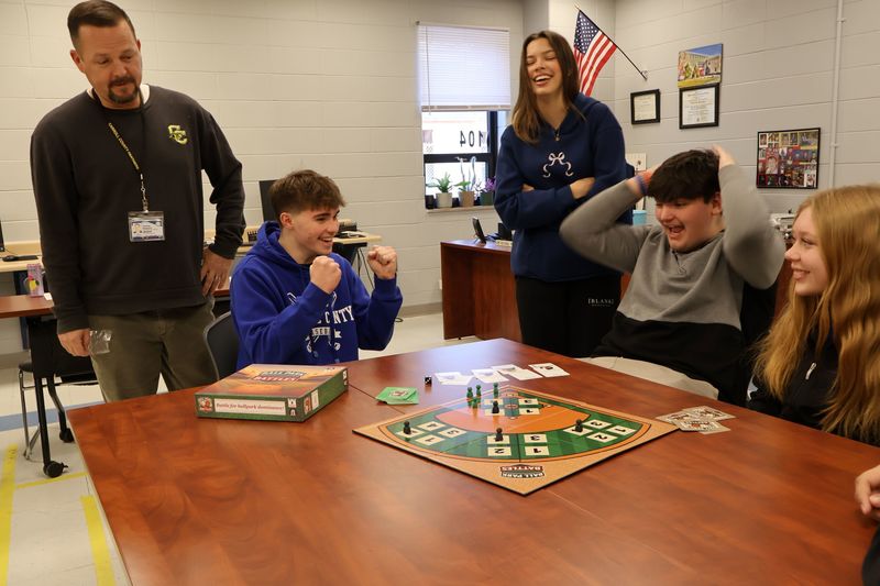 students playing board game