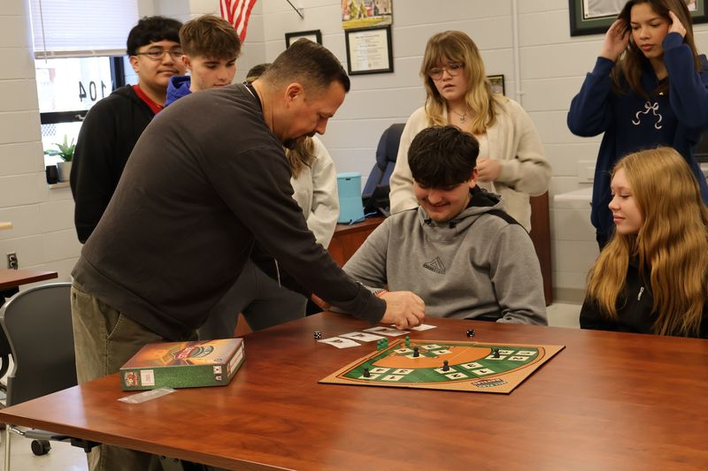 students playing board game