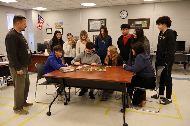 students playing board game