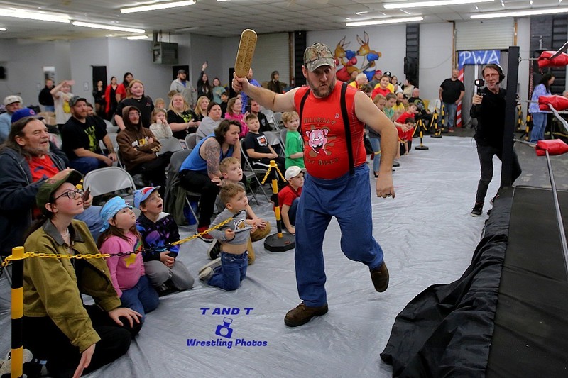 wrestler shaking hands with crowd