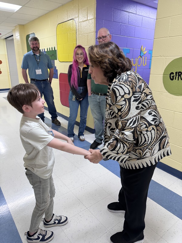 student leaders talking to adults