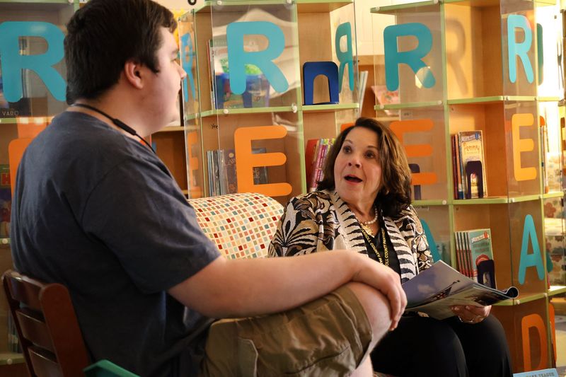 student leaders talking to adults