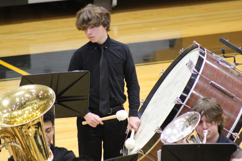 student playing drum