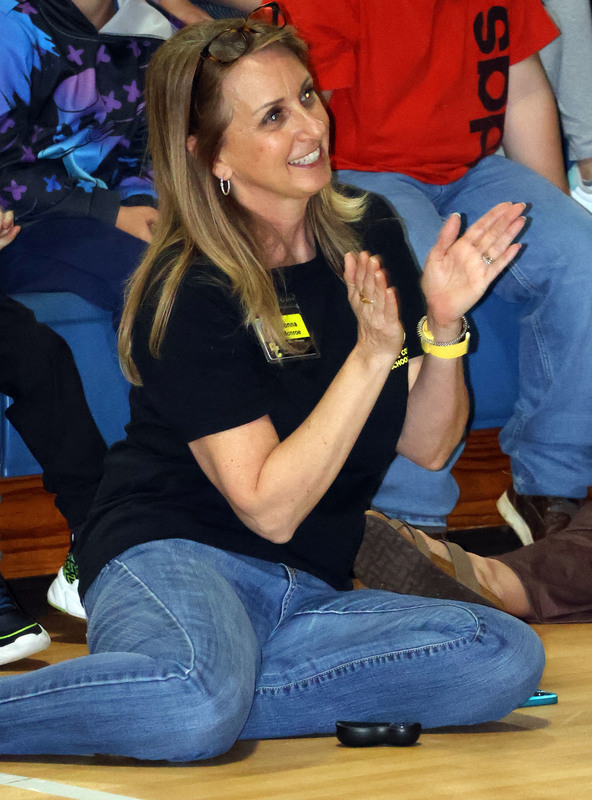 Principal clapping for students