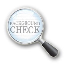 magnifying glass with background check written on it