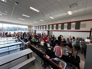 parents and students getting school supplies