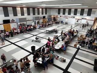 parents and students getting school supplies