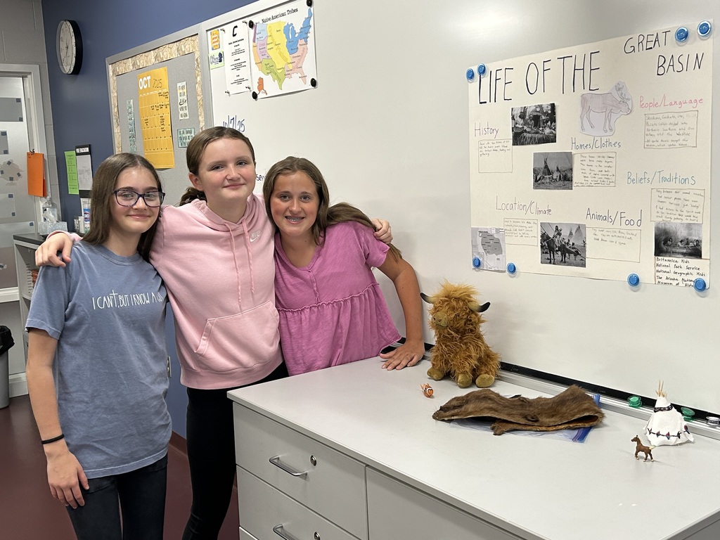 students posing with their project