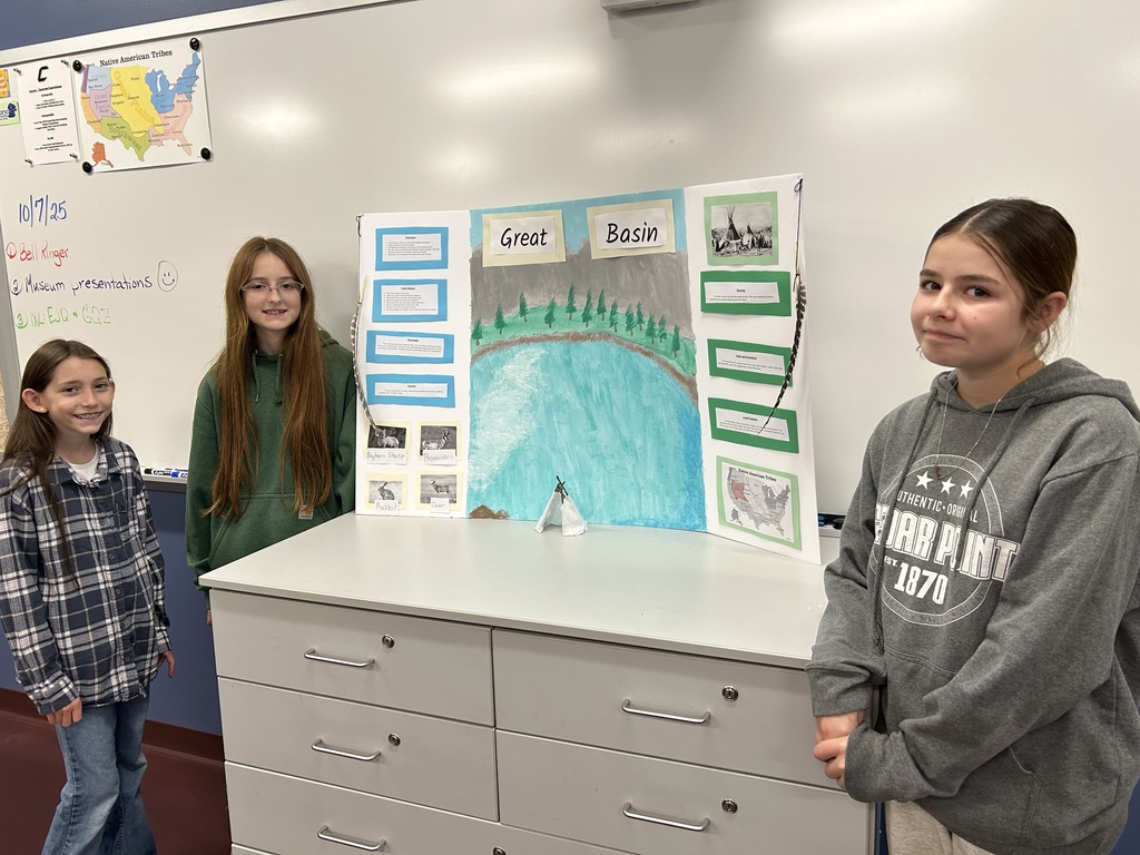 students posing with their project