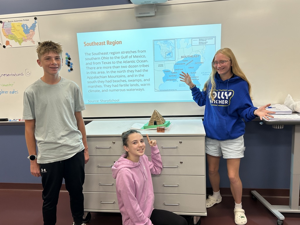 students posing with their project