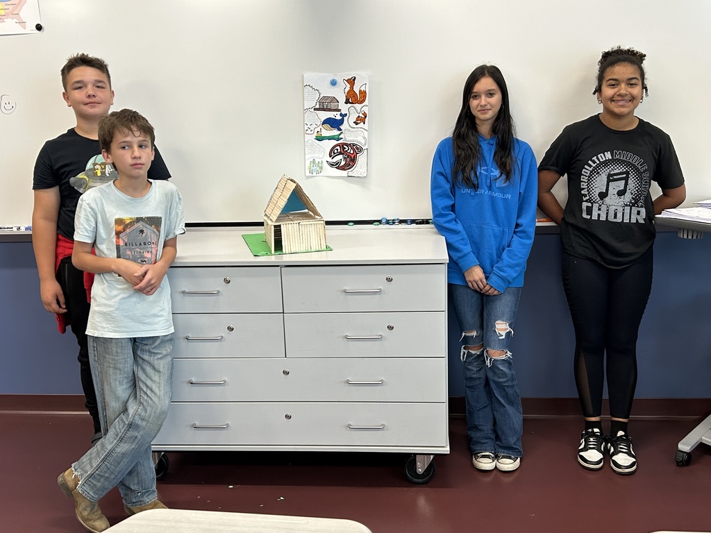 students posing with their project