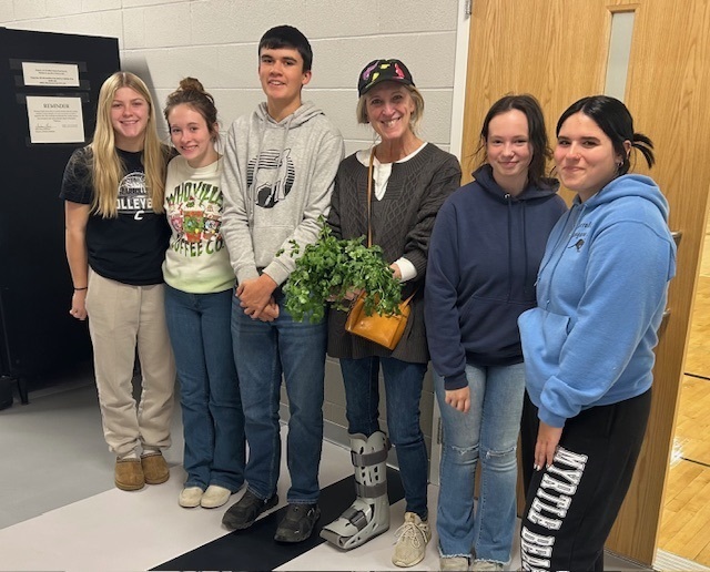 students with plants they grew